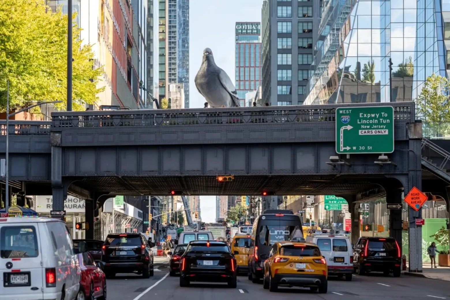 16-foot-tall 'Dinosaur' is an aluminium pigeon by Iván Argote perched in New York