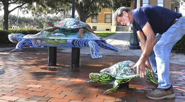 Eleven new turtle sculptures featuring recycled aluminium cans adorn Inverness